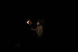 Wassailing King leading the processional song in the darkness.