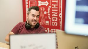 A snapshot of me in situ talking to a colleague during my time at Twilio.