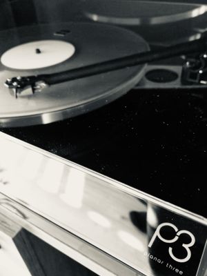 Kelly Lee Owens playing on a Planar 3 record player.